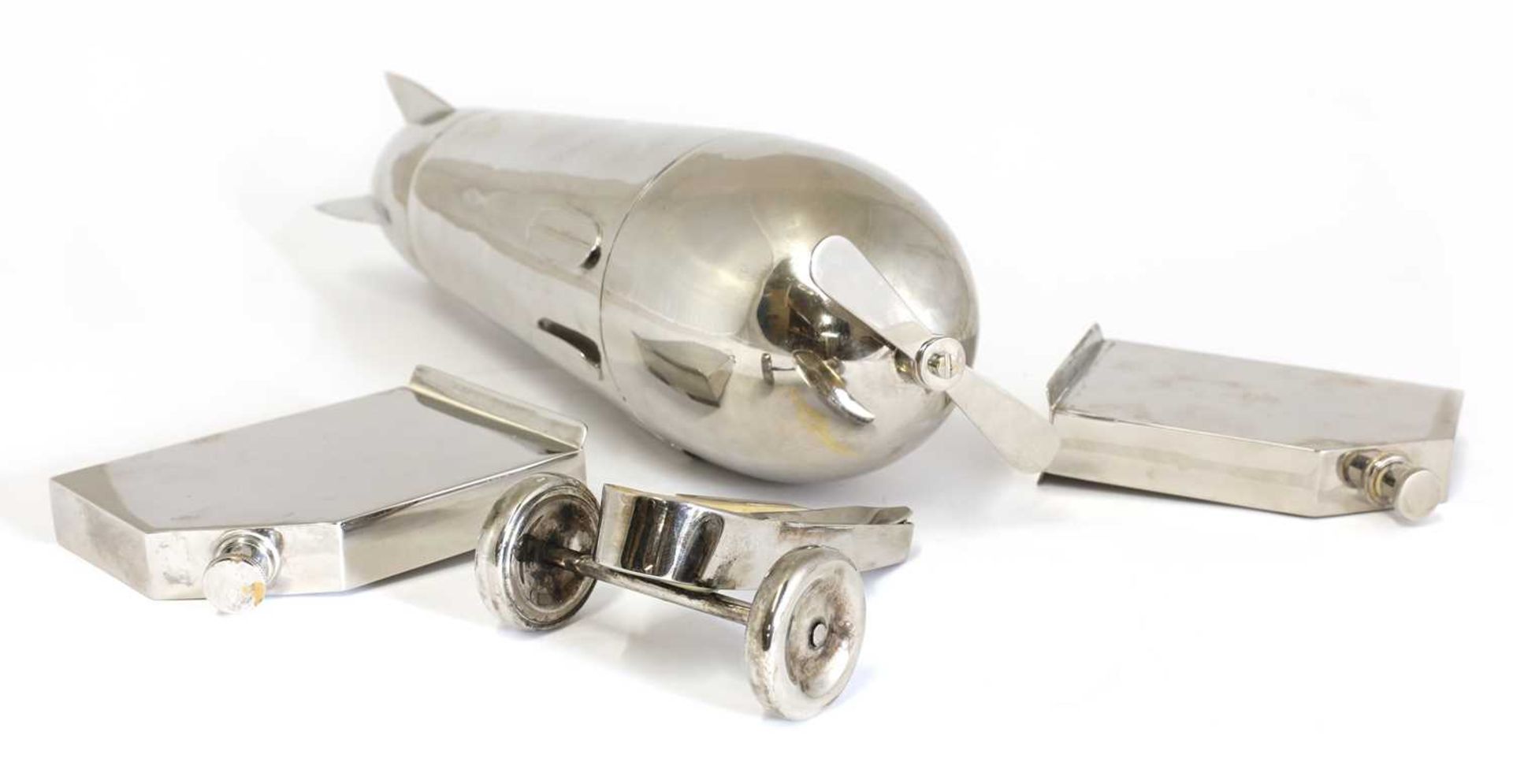 A novelty silver-plated 'monoplane' travelling bar cocktail set, - Image 7 of 8