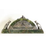 An Art Deco silvered bronze and onyx clock,
