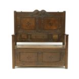 A Scottish Arts and Crafts oak settle,