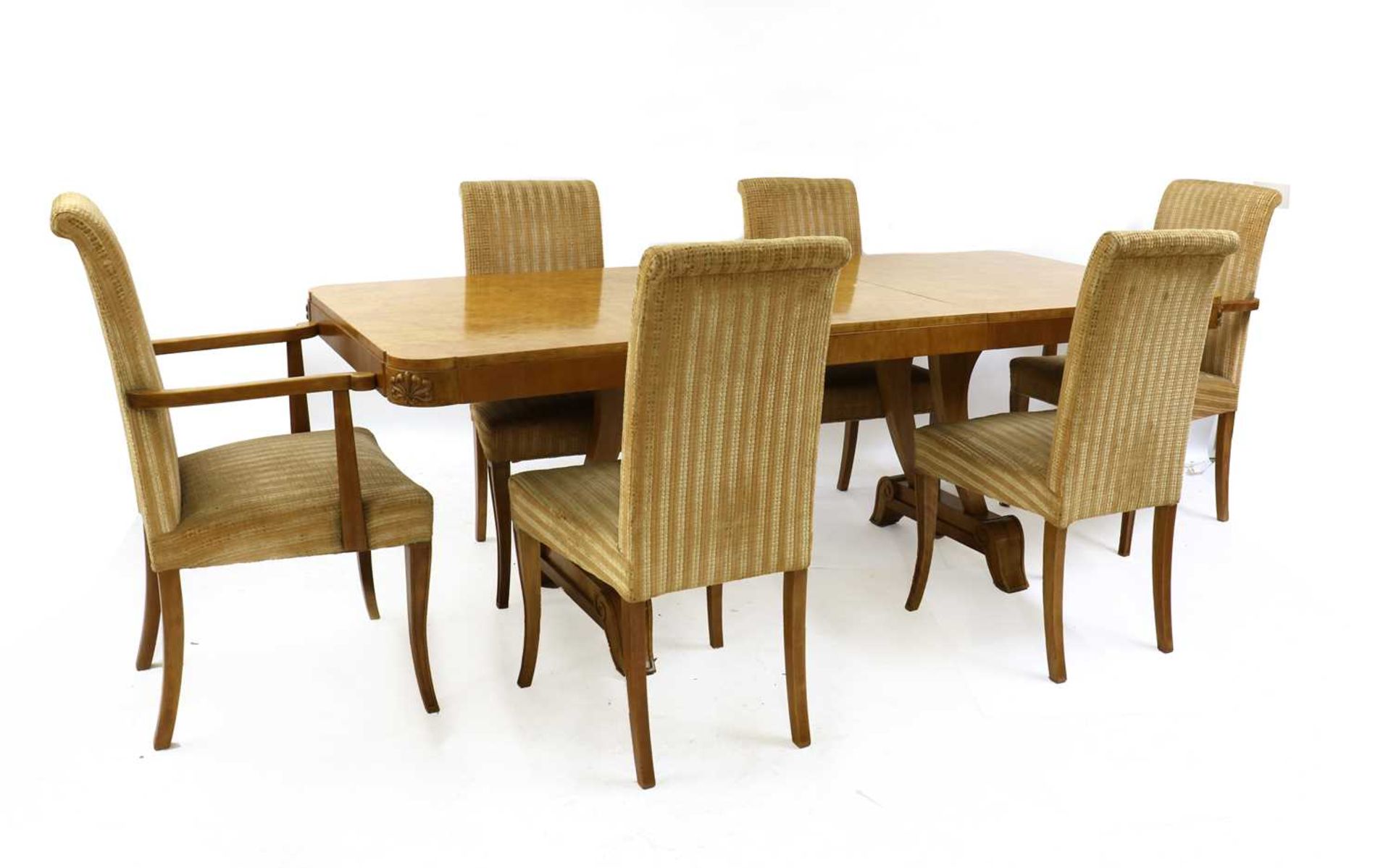 An Art Deco burr maple dining table and six chairs,