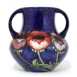 A William Moorcroft ‘Poppy’ pattern pottery vase,