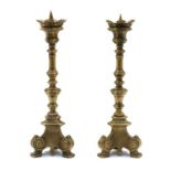 A pair of Italianate Baroque design brass pricket sticks,