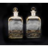 A pair of silver-mounted glass decanters,