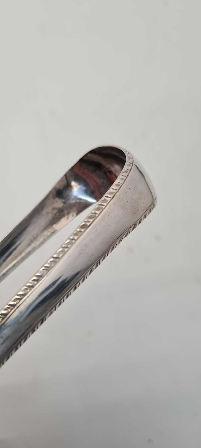 A pair of George III Irish silver sugar tongs, - Image 21 of 21