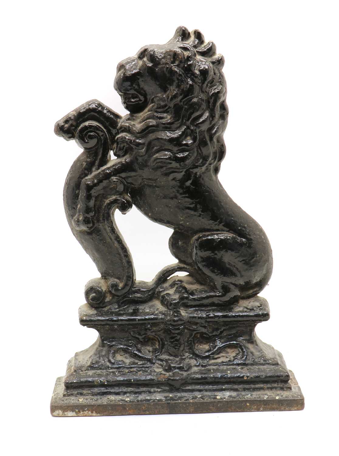 A cast iron lion rampant doorstop,