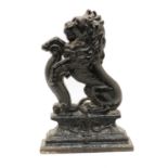 A cast iron lion rampant doorstop,