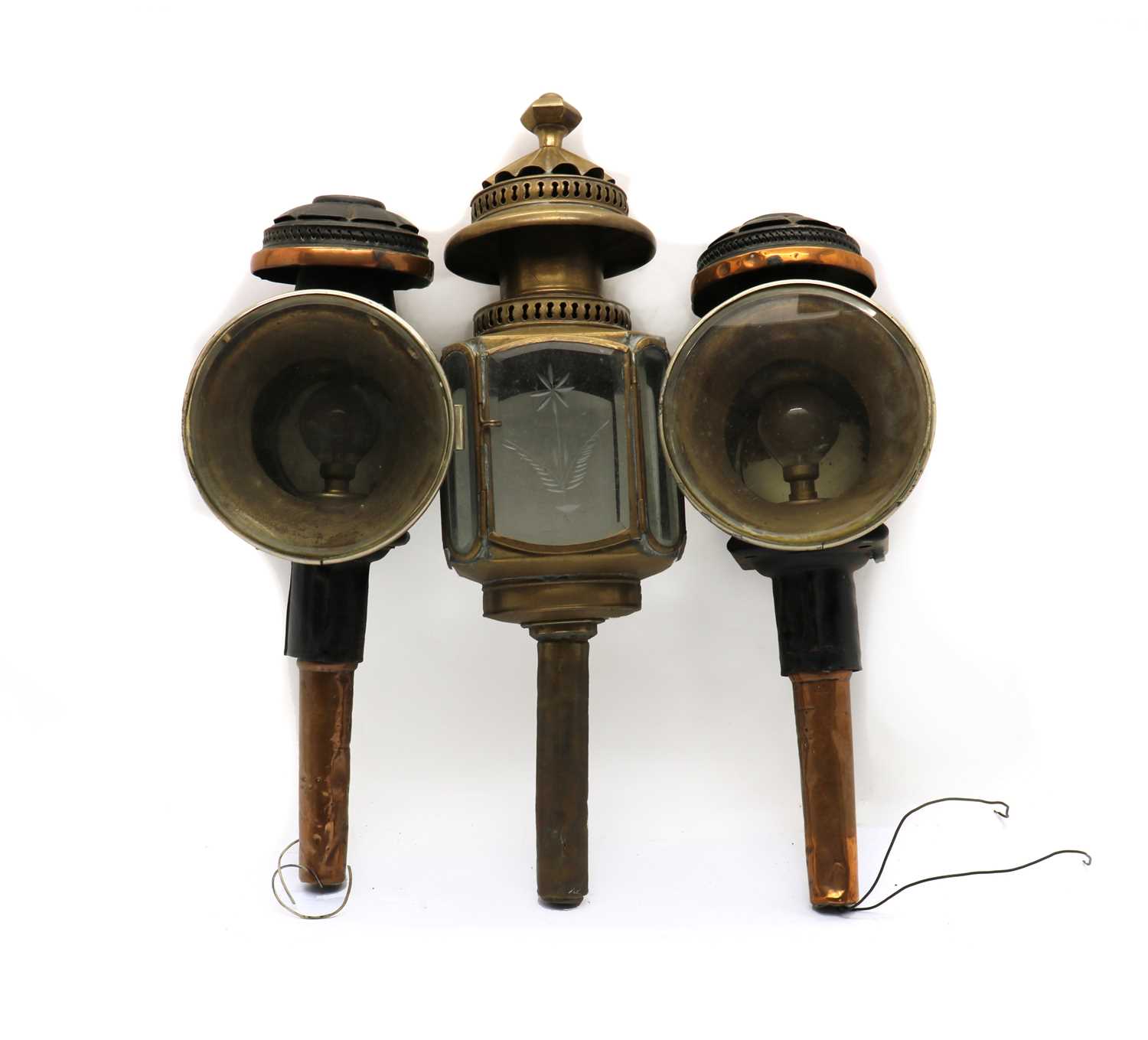 A pair of copper mounted coach lamps