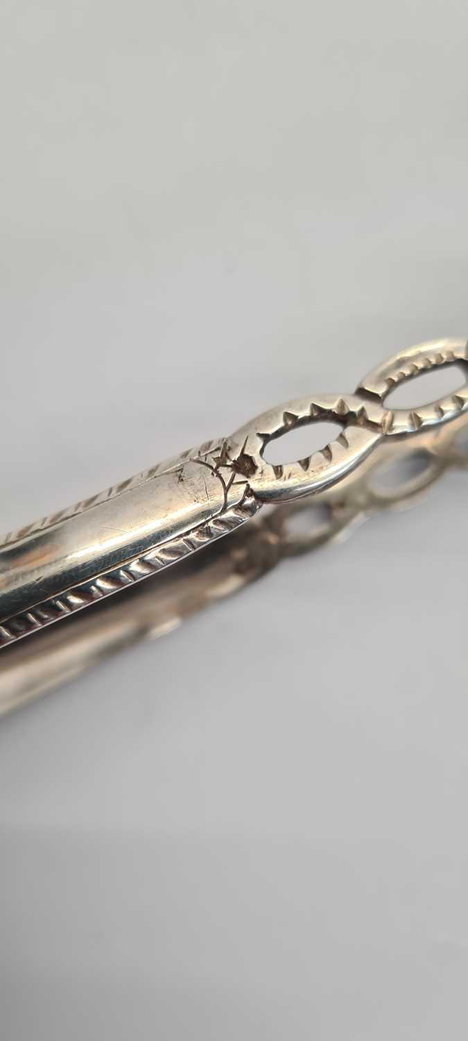 A pair of George III Irish silver sugar tongs, - Image 6 of 21