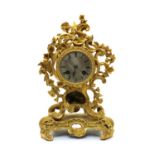 A gilt bronze mantel clock