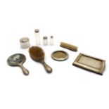 A collection of George V silver dressing table items,