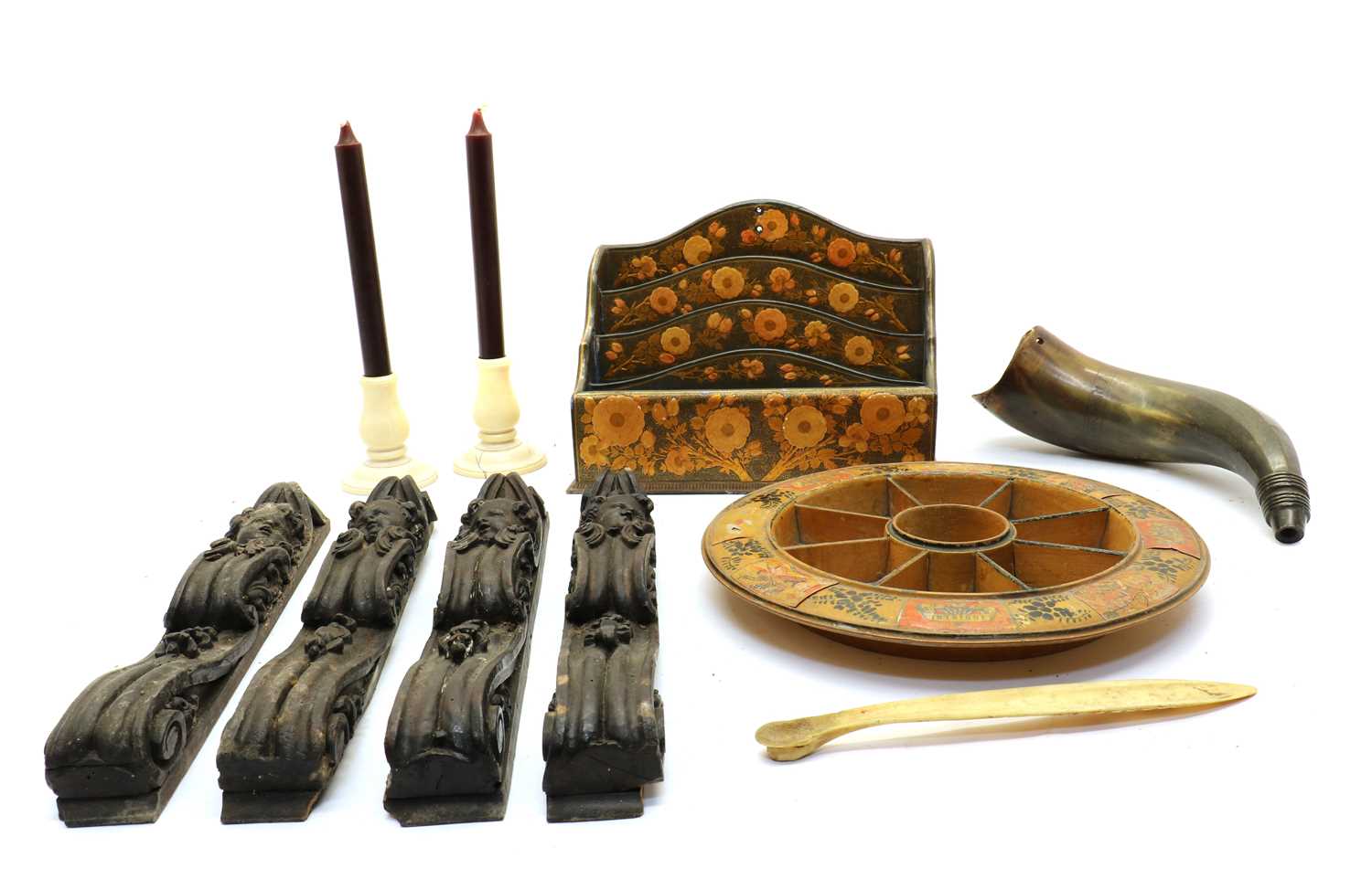 A series of four carved wood furniture mounts,