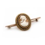 A gold mounted shell cameo brooch,