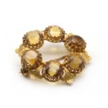 A gold citrine wreath brooch,