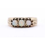 A Continental gold three stone opal ring,