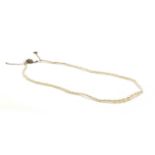 A single row graduated seed pearl necklace,