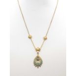 A gold turquoise and split pearl pendant,