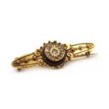 A Victorian Etruscan revival 15ct gold diamond and split pearl brooch,