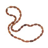 A single row uniform barrel shaped buffalo horn bead necklace,