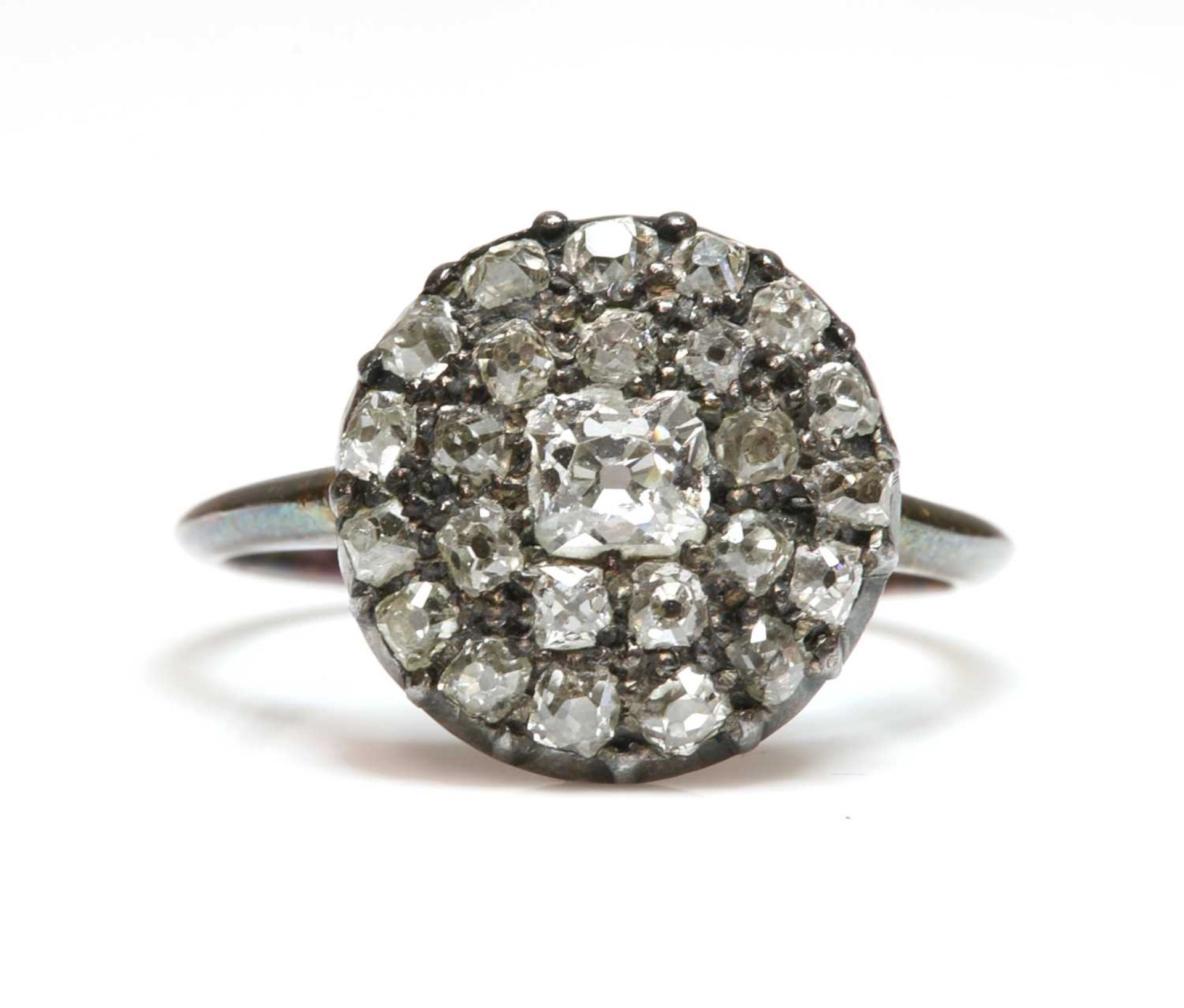 A diamond set circular cluster ring,