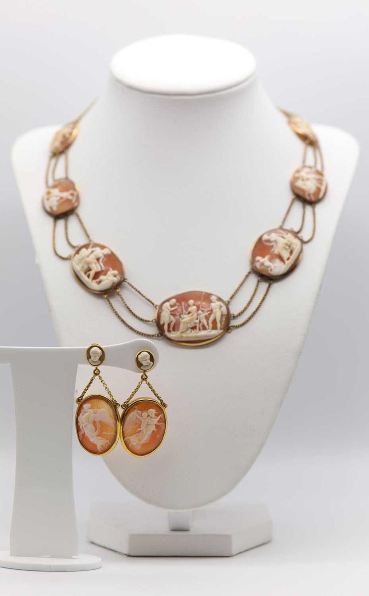 An early 19th century carved shell cameo necklace and earrings suite,