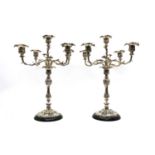 A pair of silver plated four branch candelabra,