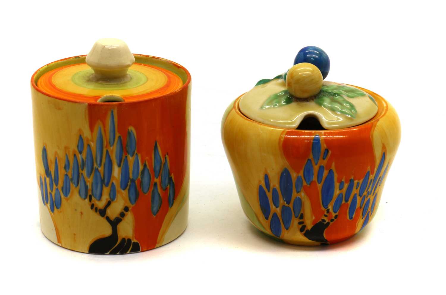 A pair of Clarice Cliff 'Windbells' pattern preserve pots and covers,