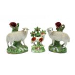 A pair of Staffordshire spill vases,