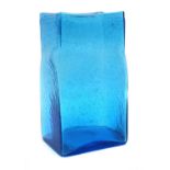 A large blue glass vase