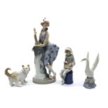 A collection of four Nao porcelain figurines,