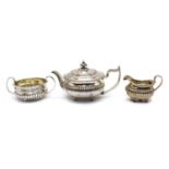 A composed silver three piece tea service