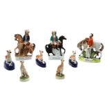 A collection of Staffordshire pottery figures