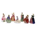 A collection of seven Royal Doulton porcelain figures,