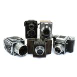 A collection of five roll film cameras,