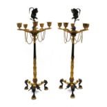 A pair of Regency style bronze and gilt bronze candelabra,