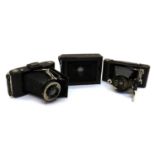 A collection of folding pocket cameras,