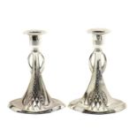 A pair of WMF silver-plated candlesticks,