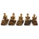 A group of five carved Balinese figures,