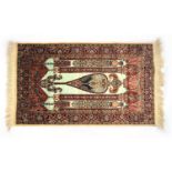 A part silk Kirman rug