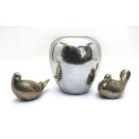 A modern polished metal vase of tapering form,