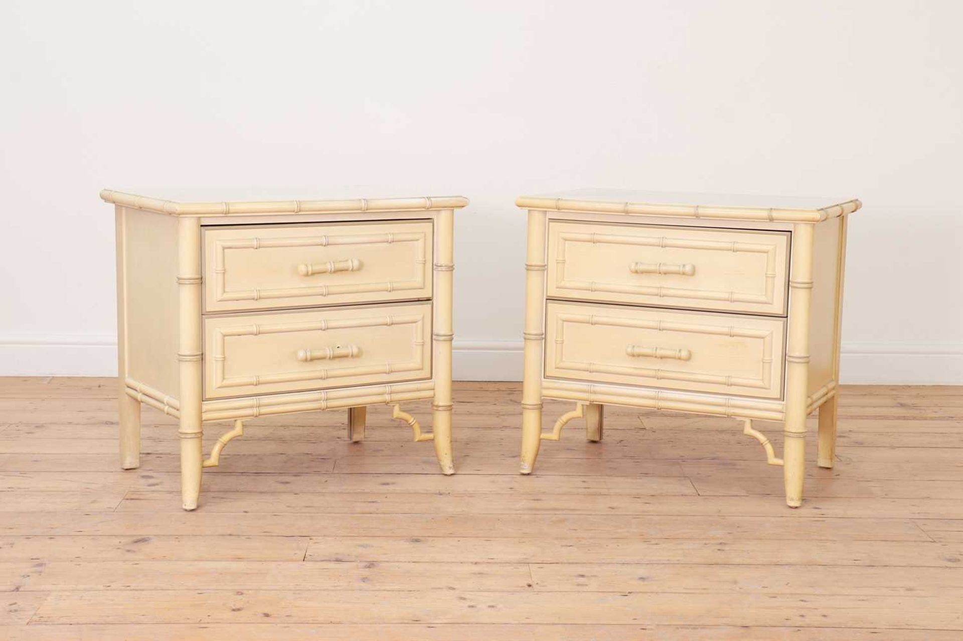 A pair of painted faux bamboo bedside tables,