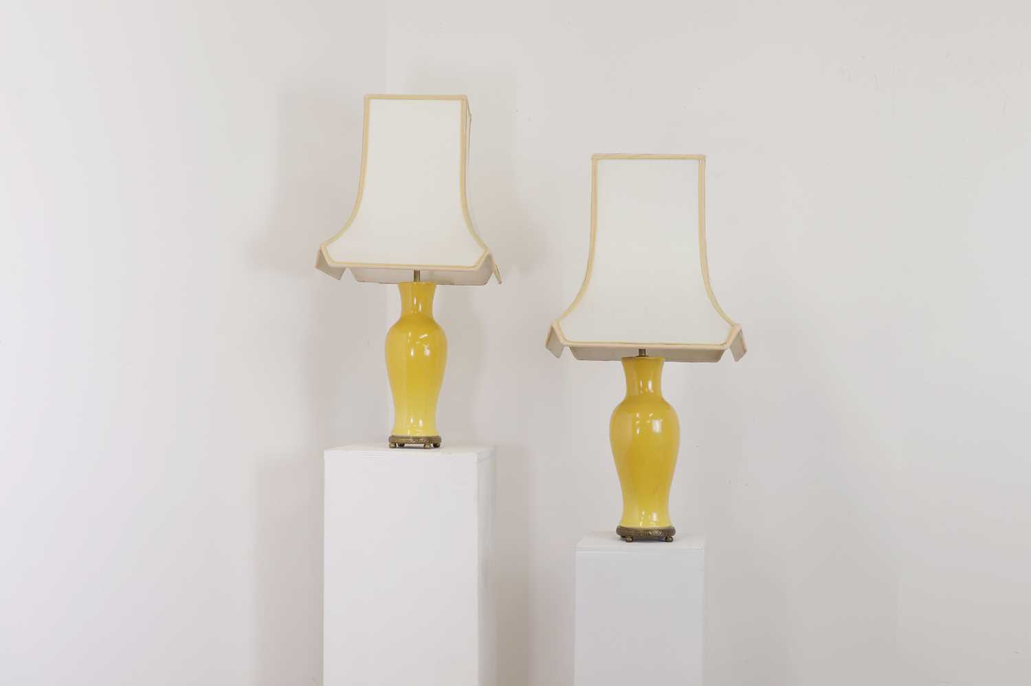 A pair of Chinese-style yellow porcelain table lamps,