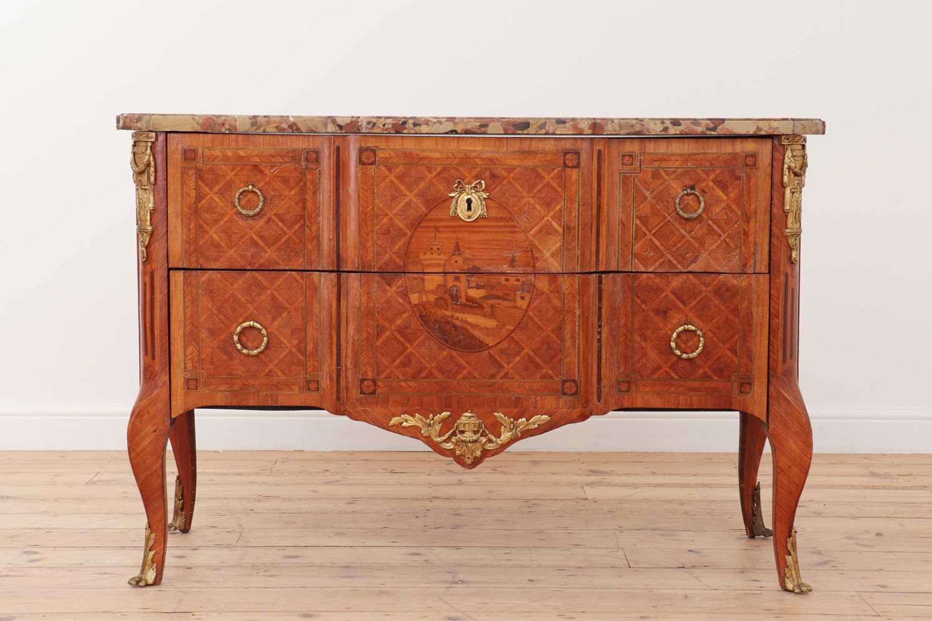 A transitional kingwood, tulipwood and marquetry commode
