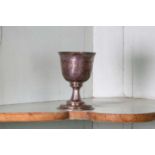 An unmarked silver communion cup,