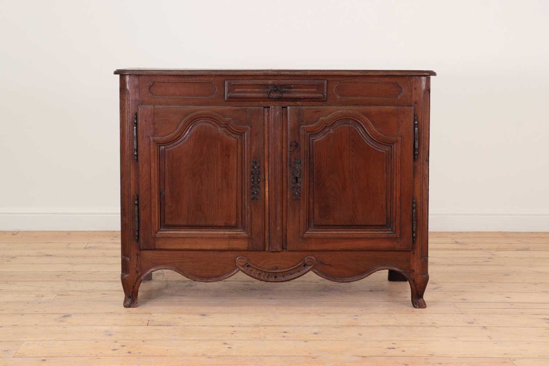 A French provincial oak side cabinet,