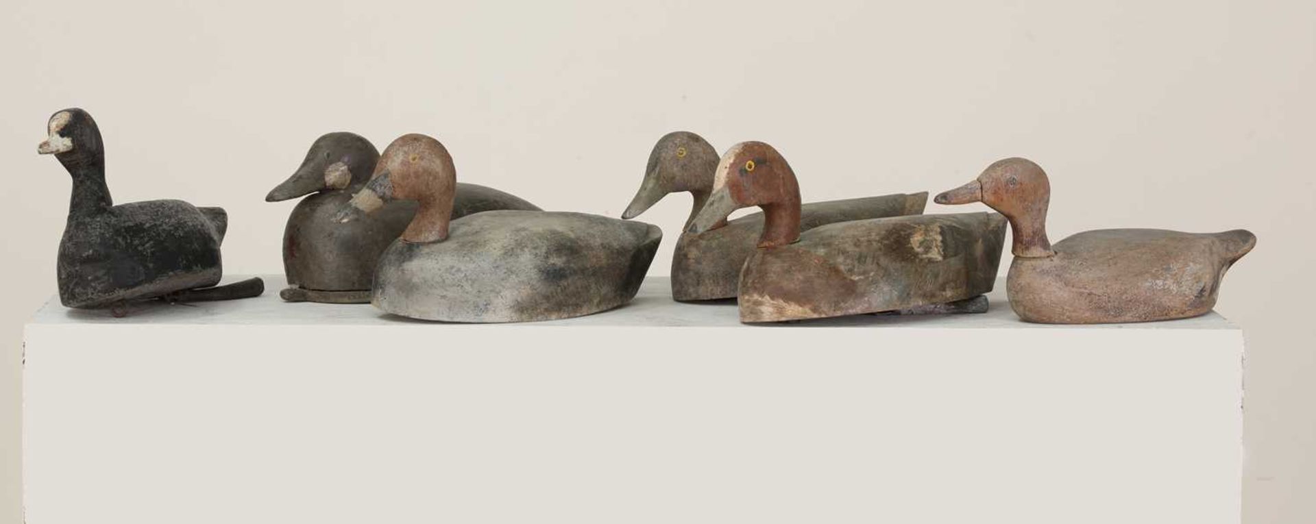 A group of six carved wooden and painted decoy ducks,