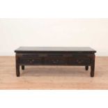 A Chinese lacquered low table,