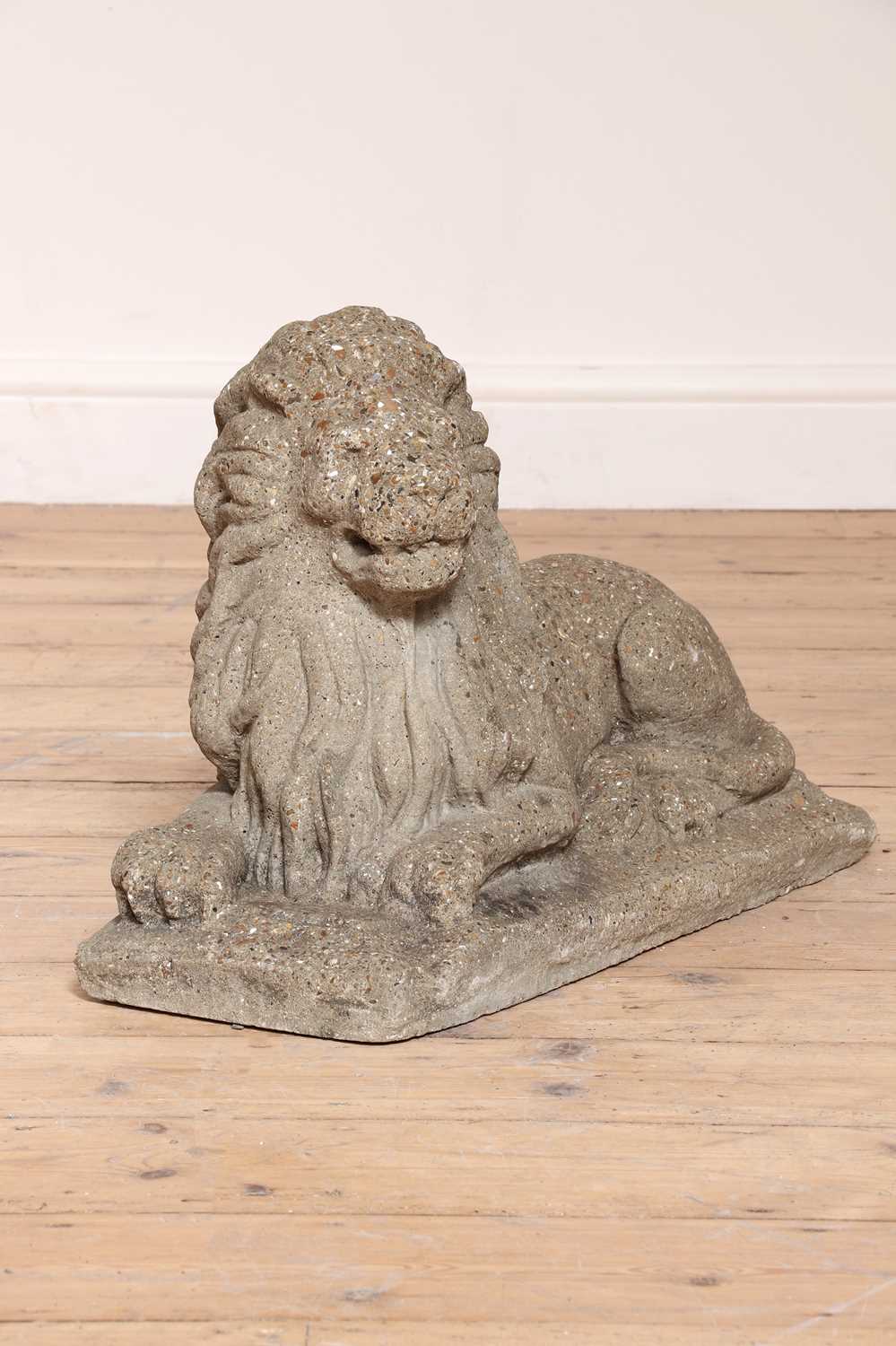 A pair of reconstituted stone recumbent lions, - Image 4 of 4