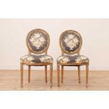 A pair of Louis XVI-style giltwood fauteuils,