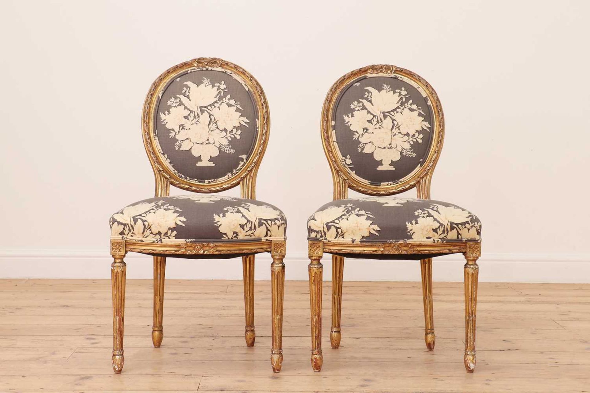 A pair of Louis XVI-style giltwood fauteuils,