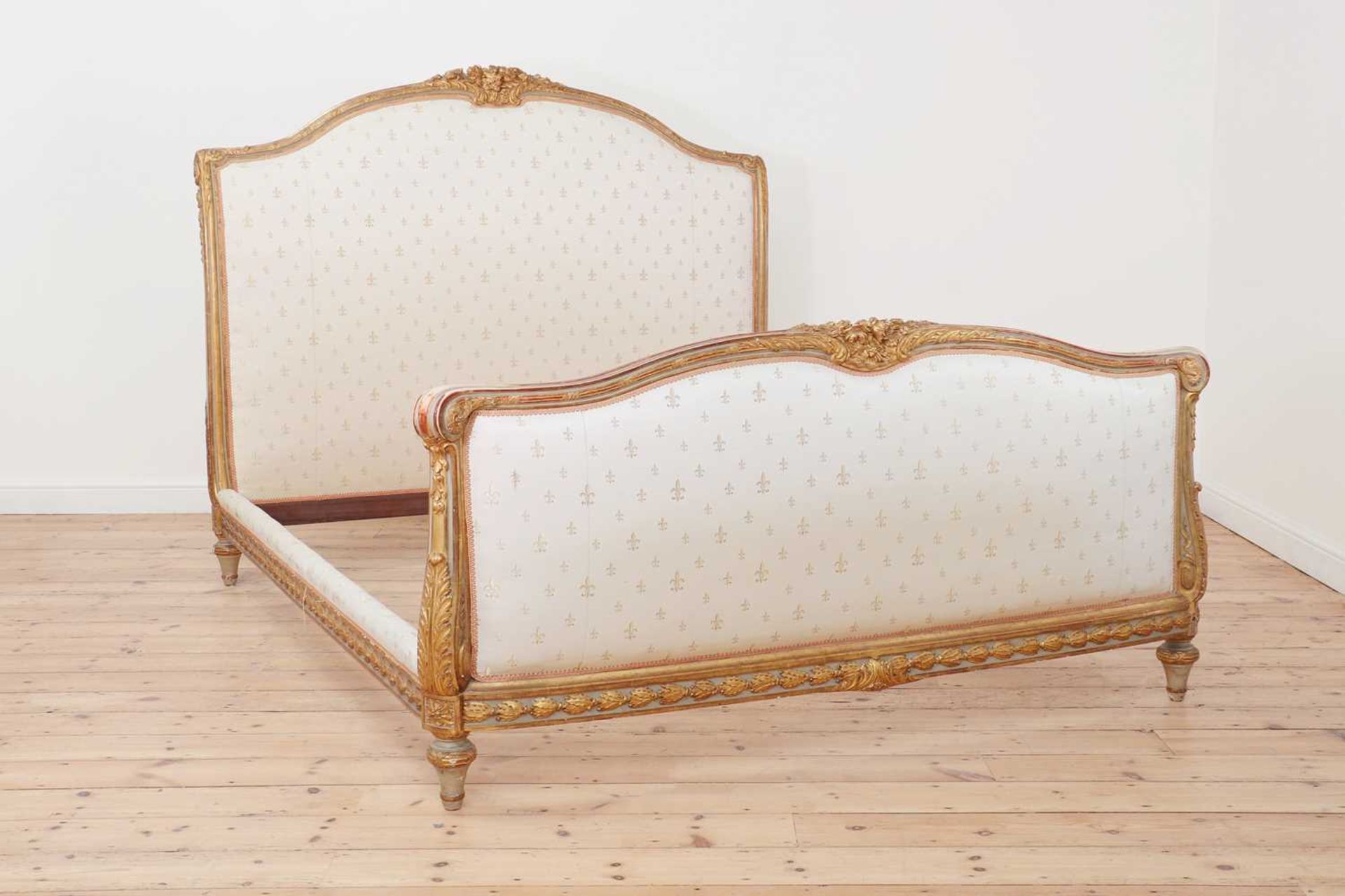 A Louis XVI-style painted and parcel-gilt double bed,